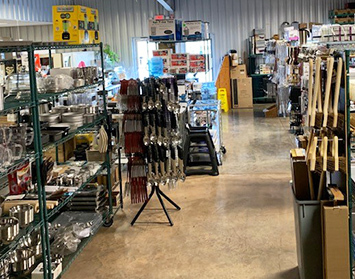 CARE Sales & Service, showroom full of pots, pans and other commercial kitchen utensils.